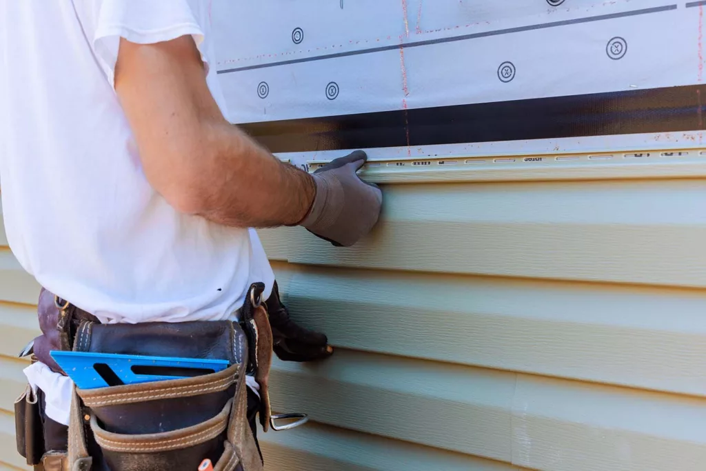 Titan Exterior Group team completing a siding project.
